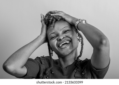 A Smiling African Lady On A Plain White Background