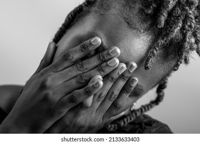 A Smiling African Lady On A Plain White Background