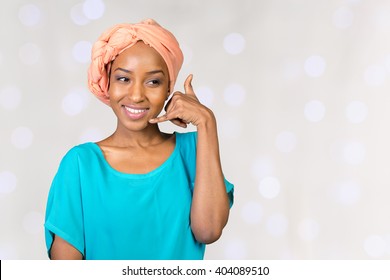 Smiling African Woman Doing Call Me Sign