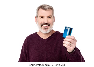 Smiling Aged Man Holding Up His Debit Card