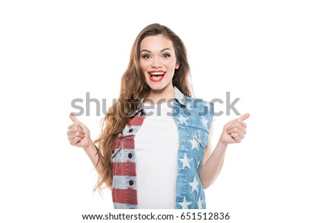 smiling american style girl showing thumbs up isolated on white