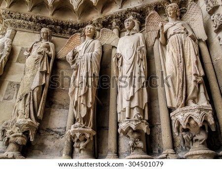 Smiling angel and the saints in the Cathedral Reims, France