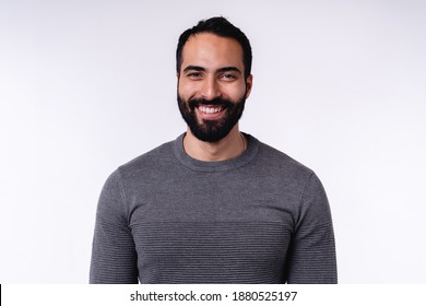 Smiling arab man in casual attire isolated over white background - Powered by Shutterstock