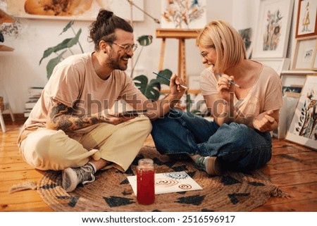 Similar – Image, Stock Photo Young woman crafting with paper at a creative workspace