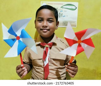 Smiling Asian Boy Wearing Scout Outfit