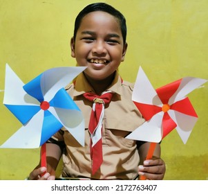 Smiling Asian Boy Wearing Scout Outfit