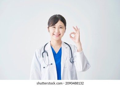 Smiling Asian Doctor OK Gesture