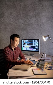 Smiling Asian IT Engineer Happy With Code He Wrote