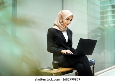 Smiling Asian Girl Student Professional Employee Typing On Laptop Sit At Outdoor Park, Happy Woman Studying E Learning Online Software Using Technology App For Work Education Concept