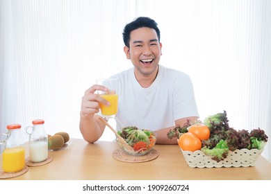 Smiling Asian Man Joyful With Healthy Food In The Morning