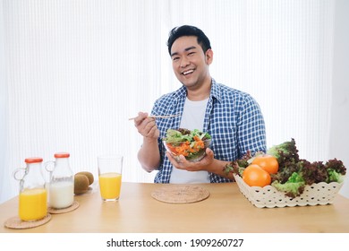 Smiling Asian Man Joyful With Healthy Food In The Morning