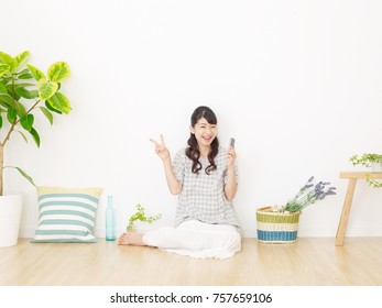 Smiling Asian Woman Peace Sign Gesture