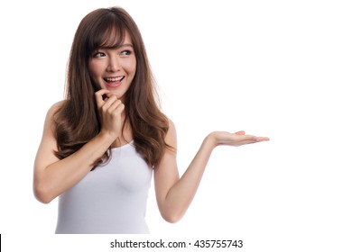 Smiling asian woman showing open hand palm to the copy space for product or something. Advertising and business concepts.