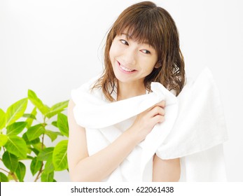 Smiling Asian Woman With The Towel