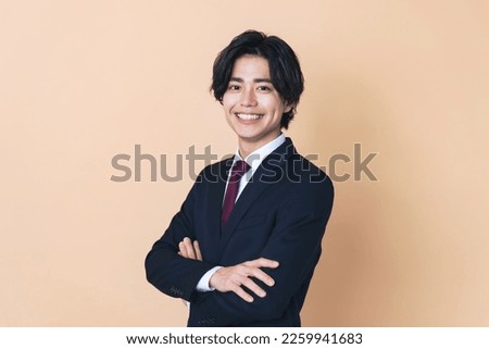 Smiling Asian young businessman portrait.