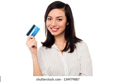 Smiling Asian Young Female Model Holding Up Credit Card.