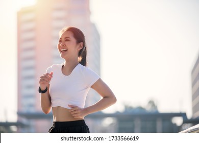 smiling Asian Young fitness sport woman running  and Sportive people training in a urban area, healthy lifestyle and sport concepts
 - Powered by Shutterstock