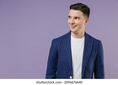 Smiling Attractive Fun Young Successful Employee Business Man Corporate Lawyer 20s Wears Formal Blue Suit White T-shirt Work In Office Look Aside Isolated On Pastel Purple Background Studio Portrait.