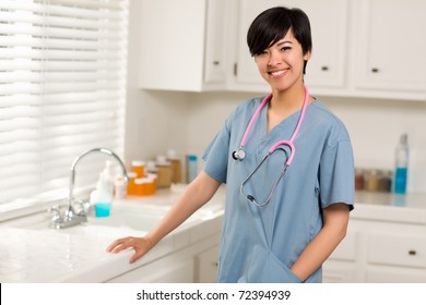 Smiling Attractive Mixed Race Doctor Or Nurse In An Office Or Laboratory Setting.