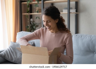 Smiling Attractive Woman Opening Big Carton Box, Feeling Curious Of Unpacking Internet Store Order At Home. Happy Millennial Female Client Satisfied With Fast Delivery Service, Online Shopping Concept