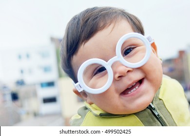 Smiling Baby Boy Wearing Glasses 