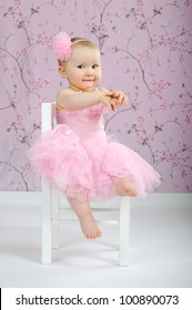 Smiling Baby Dressed In Pink Tutu