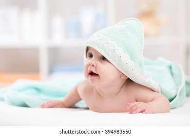 Smiling Baby Girl After Shower With Towel On Head