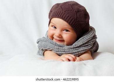 Smiling Baby Girl In Scarf And Beret