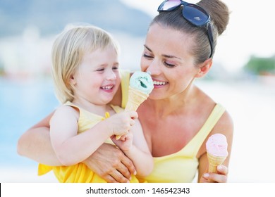 Smiling Baby Giving Mother Ice Cream