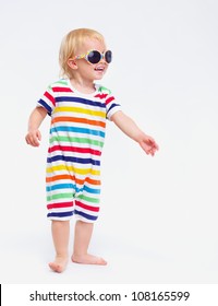 Smiling Baby In Swimsuit And Sunglasses Looking On Copy Space