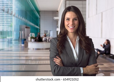 Smiling bank manager welcoming warm personality bright big smile in large building - Powered by Shutterstock