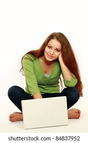 Smiling Barefoot Teenage Girl With Laptop Isolated