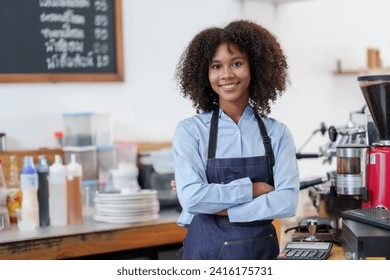 A smiling barista wearing an apron stands confidently in a bustling coffee shop, embodying excellent customer service.
 - Powered by Shutterstock