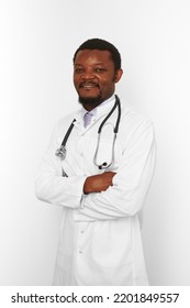 Smiling Bearded Doctor Man Crossed Arms In White Robe With Stethoscope Isolated On White Background. Adult Black African American Physician Therapist Portrait, Confident Candid Male Emotion