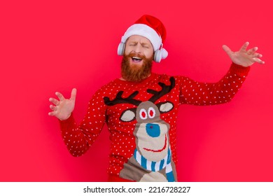 Smiling Bearded Man Celebrate Christmas With Music. Man In Headphones Listen Christmas Music