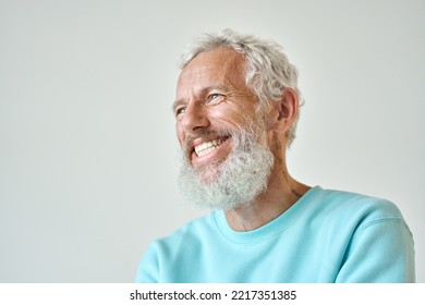 Smiling Bearded Mature Older Fashion Gray-haired Hipster Man, Happy Old Senior Male Model Having Fun Feeling Cheerful Looking Away Laughing Standing Isolated At White Wall. Close Up Headshot