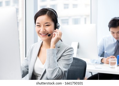 Smiling Beautiful Asian Woman Working In Call Center Office As A Customer Service Operator