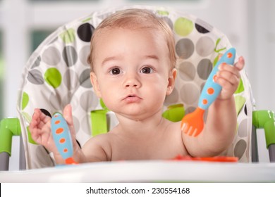 Smiling Beautiful Baby Child Holding Cutlery