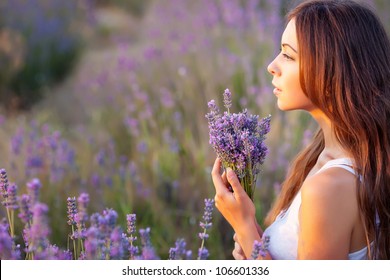 smiling beautiful brunette in the lavender field