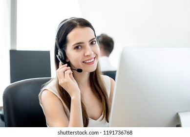 Smiling beautiful friendly woman working in call center office as the customer care operator - Shutterstock ID 1191736768