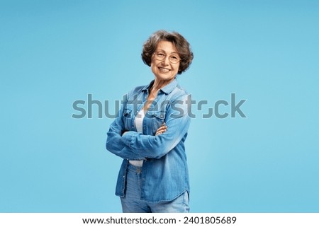 Similar – Image, Stock Photo Old smiling retired woman doing a live streaming near the sea, answering followers and saying hello.