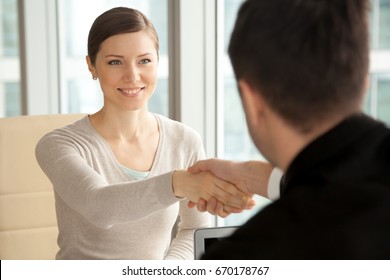 Smiling Beautiful Woman Shaking Male Hand, Greeting Handshake Of Female Applicant Arriving At Job Interview, Businesswoman Making Good First Impression At Meeting With New Partner, Women In Business 