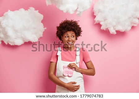 Similar – Image, Stock Photo Pregnant woman and little daughter in the rustic kitchen