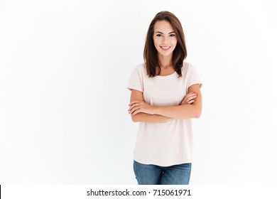 Smiling beauty woman with crossed arms looking at the camera over white background