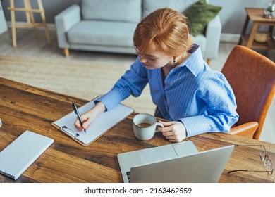 Smiling Beauyiful Teen Girl Preparing School Homework, Using Laptop, Happy Black Schoolgirl, Pupil Doing Tasks, Writing Essay, Studying At Home, Making Notes, Writing, Reading Textbooks



