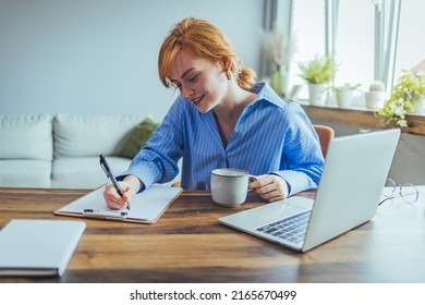 Smiling Beauyiful Teen Girl Preparing School Homework, Using Laptop, Happy Black Schoolgirl, Pupil Doing Tasks, Writing Essay, Studying At Home, Making Notes, Writing, Reading Textbooks



