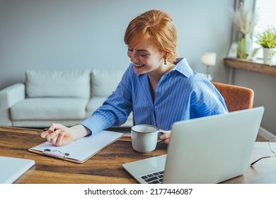 Smiling Beauyiful Teen Girl Preparing School Homework, Using Laptop, Happy Black Schoolgirl, Pupil Doing Tasks, Writing Essay, Studying At Home, Making Notes, Writing, Reading Textbooks



