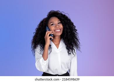 Smiling black businesswoman talking the phone  african woman portrait purple gradient background  Concept communication   social media