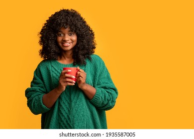 Smiling Black Woman Holding Red Mug, Drinking Coffee