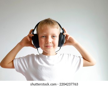 Smiling Blond Boy 6 Years Old In Black Headphones